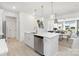 Open-concept kitchen boasts a central island, stainless steel dishwasher, and modern pendant lighting at 492 Switch St # 82 Ty, York, SC 29745