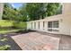Large backyard features a cozy patio area with beautiful landscaping and room to enjoy at 4929 Prentice Pl, Charlotte, NC 28210