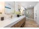 This stylish bathroom features double sinks, modern finishes and stunning walk-in shower at 4929 Prentice Pl, Charlotte, NC 28210