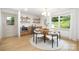 Inviting dining area featuring a round wooden table, stylish chairs, and bright lighting at 4929 Prentice Pl, Charlotte, NC 28210