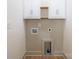 Clean and functional laundry room with storage cabinets and washer/dryer hookups at 4929 Prentice Pl, Charlotte, NC 28210