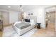 Bright main bedroom boasts hardwood floors, neutral decor and ensuite bathroom with walk-in shower at 4929 Prentice Pl, Charlotte, NC 28210
