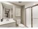 Modern bathroom features a white vanity, a shower with glass doors and neutral wall color at 524 Lenswood Ct, Denver, NC 28037