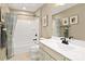 Well-lit bathroom with a white vanity, shower and tub combination and neutral walls at 524 Lenswood Ct, Denver, NC 28037