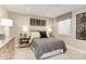 Tastefully decorated bedroom featuring a window, a queen bed with decorative pillows, and a nightstand at 524 Lenswood Ct, Denver, NC 28037