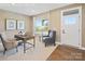 Bright living room featuring a light-filled window, neutral decor, and a comfortable sitting area for relaxing at 524 Lenswood Ct, Denver, NC 28037