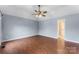 Comfortable bedroom with hardwood floors and a ceiling fan for added relaxation at 5410 Berryview Ln, Gastonia, NC 28056