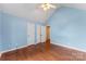 Bright bedroom features a vaulted ceiling and laminate flooring at 5410 Berryview Ln, Gastonia, NC 28056