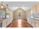 Charming dining room featuring granite countertops, white cabinetry, and hardwood floors at 5410 Berryview Ln, Gastonia, NC 28056