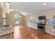 Bright kitchen with granite countertops, stainless steel appliances, and hardwood floors at 5410 Berryview Ln, Gastonia, NC 28056