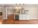 Open kitchen with granite counters, stainless appliances, and hardwood floors at 5410 Berryview Ln, Gastonia, NC 28056