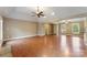 Bright living room boasts hardwood floors and a vaulted ceiling with fan at 5410 Berryview Ln, Gastonia, NC 28056