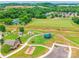 Aerial view of community park featuring sports fields, playground, and parking at 5623 Fetzer Nw Ave, Concord, NC 28027