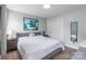 Serene bedroom featuring light-colored walls, hardwood floors, and a stylish gray bed frame at 5623 Fetzer Nw Ave, Concord, NC 28027