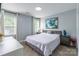 Serene bedroom featuring light-colored walls, hardwood floors, and a stylish gray bed frame at 5623 Fetzer Nw Ave, Concord, NC 28027