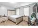 Spacious bedroom with wood-look floors, plenty of natural light, and stylish matching nightstands at 5623 Fetzer Nw Ave, Concord, NC 28027