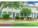 Lovely townhome with a well-manicured lawn, blue shutters, and inviting front entrance at 5623 Fetzer Nw Ave, Concord, NC 28027