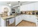 Bright kitchen with white cabinets, granite countertops, and stainless steel appliances for a modern appeal at 5623 Fetzer Nw Ave, Concord, NC 28027
