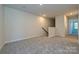 Upstairs bonus room with carpet flooring, neutral paint and natural light at 7028 Alva Ter, Charlotte, NC 28216