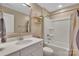 Clean bathroom with white vanity, modern fixtures, and shower-tub combo for relaxation and convenience at 7046 North Bridge Dr, Huntersville, NC 28078