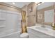 Full bathroom with a shower-tub combo and neutral decor at 7046 North Bridge Dr, Huntersville, NC 28078