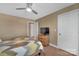 Simple bedroom with ceiling fan, tv and closet at 7046 North Bridge Dr, Huntersville, NC 28078