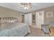 Cozy bedroom with neutral tones, ensuite bathroom, and a sitting area at 7046 North Bridge Dr, Huntersville, NC 28078