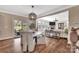 Open-concept dining area leading to a living room, and a patio with outdoor seating at 7046 North Bridge Dr, Huntersville, NC 28078