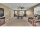 Game room featuring a pool table, comfortable seating, and natural light, ideal for recreation and relaxation at 7046 North Bridge Dr, Huntersville, NC 28078