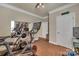 Home gym featuring multiple exercise machines and wall mirror at 7046 North Bridge Dr, Huntersville, NC 28078