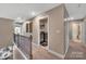 Upper hallway with a laundry room, neutral colors, and modern railing, creating a clean and functional space at 7046 North Bridge Dr, Huntersville, NC 28078