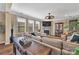 Cozy living room featuring a fireplace, hardwood floors, and comfortable seating at 7046 North Bridge Dr, Huntersville, NC 28078