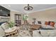 A cozy living room with a stone fireplace, comfortable seating, and modern decor at 7046 North Bridge Dr, Huntersville, NC 28078