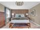 Comfortable bedroom featuring a textured accent wall, modern lighting, and ample space at 7046 North Bridge Dr, Huntersville, NC 28078