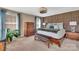 Comfortable bedroom featuring a textured accent wall, modern lighting, and ample space at 7046 North Bridge Dr, Huntersville, NC 28078