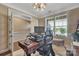 A modern office space with a wooden desk and a view from the window at 7046 North Bridge Dr, Huntersville, NC 28078