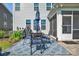 Cozy outdoor patio featuring a dining set with umbrella and screened in porch, perfect for relaxing at 7046 North Bridge Dr, Huntersville, NC 28078