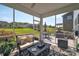 Inviting screened porch with comfortable seating and outdoor dining, perfect for enjoying the beautiful backyard view at 7046 North Bridge Dr, Huntersville, NC 28078