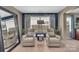 Cozy sitting area with comfortable chairs, a stylish mirror, and a window with natural light at 7046 North Bridge Dr, Huntersville, NC 28078
