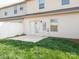 Backyard featuring a small patio and lush green grass at 709 Volta Nw Dr, Concord, NC 28027