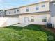 Backyard featuring a small patio and lush green grass at 709 Volta Nw Dr, Concord, NC 28027