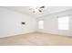 A well-lit bedroom features plush carpeting, a wall mounted TV, and an open layout at 709 Volta Nw Dr, Concord, NC 28027