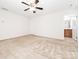 Large bedroom featuring neutral carpeting and ensuite bathroom at 709 Volta Nw Dr, Concord, NC 28027