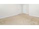 Clean bedroom with neutral carpet and white trim, featuring two doors at 709 Volta Nw Dr, Concord, NC 28027