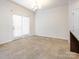 Open dining room featuring neutral carpeting and sliding glass doors at 709 Volta Nw Dr, Concord, NC 28027