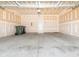 Clean garage with a white door to the home at 709 Volta Nw Dr, Concord, NC 28027