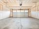 Spacious garage with high ceilings and an automatic door at 709 Volta Nw Dr, Concord, NC 28027