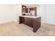 Gourmet kitchen with a center island, granite countertops, stainless appliances, and rich cabinetry at 709 Volta Nw Dr, Concord, NC 28027