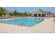 Community pool with comfortable lounge seating and clubhouse at 709 Volta Nw Dr, Concord, NC 28027