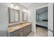Bathroom features a double granite vanity and a doorway that leads to the main bedroom at 7344 Maitland Ln, Charlotte, NC 28215